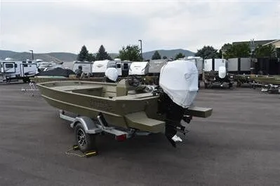 Slide: The Image of 2025 Lowe Roughneck 1860 Rambler boat on trailer, parked in outdoor lot. - 5