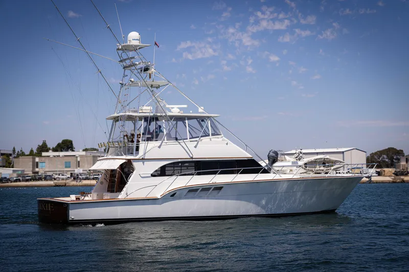 Slide: The Image of 1988 Donzi yacht cruising on water under a clear blue sky. - 1
