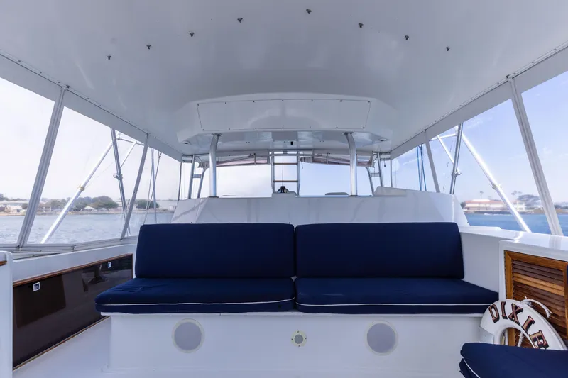 Slide: The Image of Interior of a 1988 Donzi boat with blue seating and panoramic windows. - 10