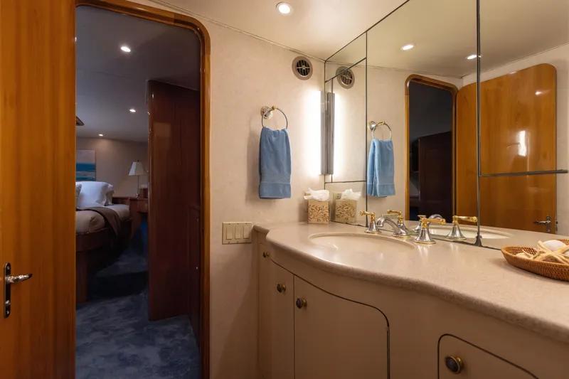 Slide: The Image of Luxurious 1988 Donzi yacht bathroom with elegant fixtures and mirrored vanity. - 13