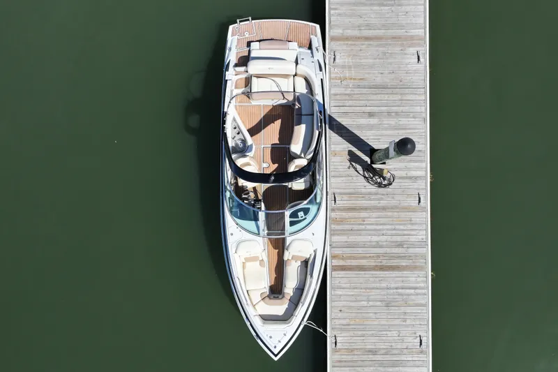 Slide: The Image of Overhead view of 2017 Crownline 275 SS boat docked on calm water. - 7