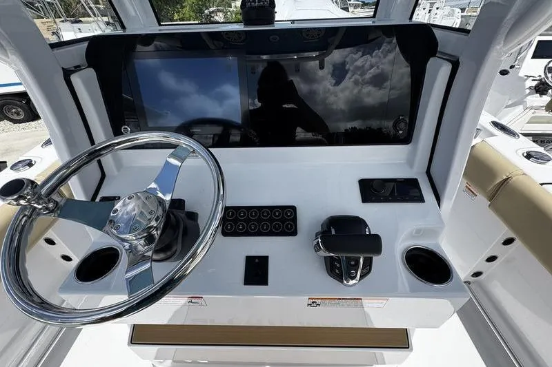 Slide: The Image of 2026 Sportsman Open 232 Center Console dashboard with steering wheel and controls. - 14