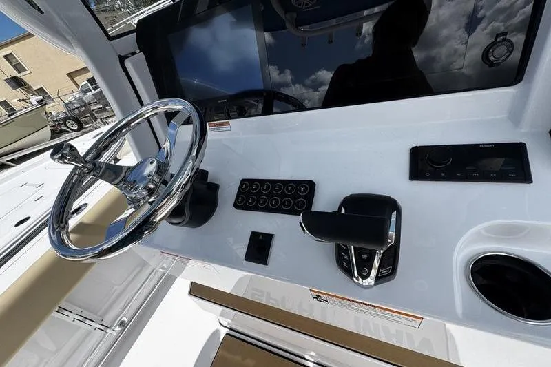 Slide: The Image of 2026 Sportsman Open 232 Center Console dashboard with steering wheel and controls. - 15