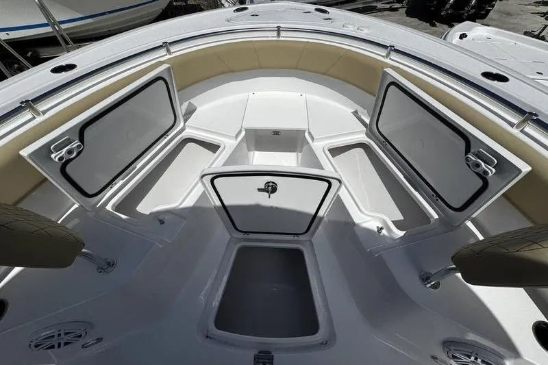 Slide: The Image of 2026 Sportsman Open 232 Center Console boat interior with open storage compartments. - 4