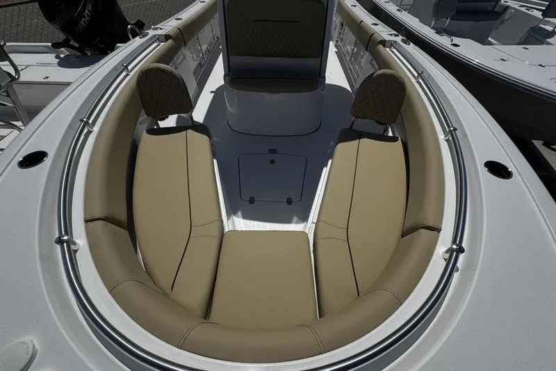 Slide: The Image of 2026 Sportsman Open 232 Center Console boat with tan cushioned seating. - 5