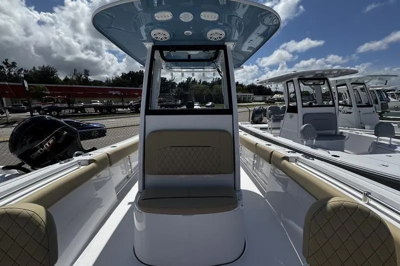 Slide: The Image of 2026 Sportsman Open 232 Center Console boat interior with seating and console view. - 9