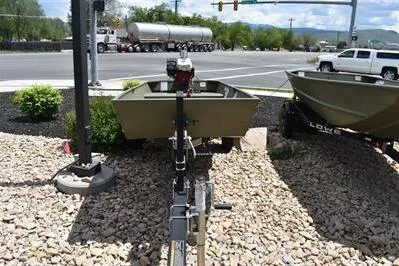 Slide: The Image of 2024 Lowe L1240 Jon boat on trailer at roadside display. - 6
