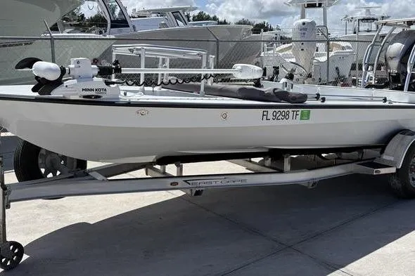 The Image of 2022 East Cape Vantage boat on trailer, parked outdoors, with visible registration number. - 1