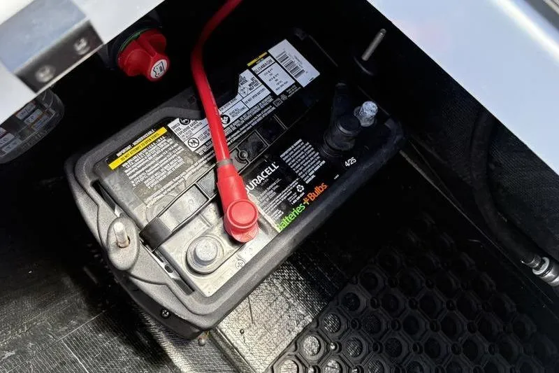 Slide: The Image of Battery compartment of a 2022 East Cape Vantage boat with visible wiring. - 14