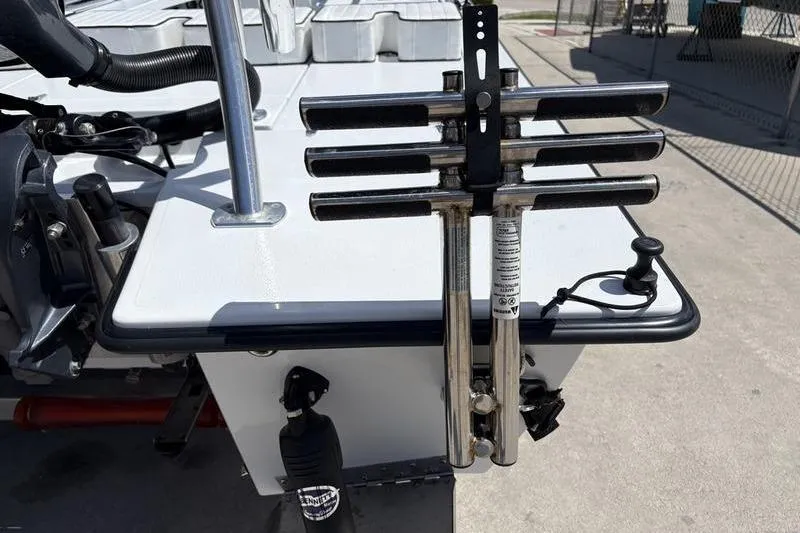 Slide: The Image of 2022 East Cape Vantage boat stern with rod holders and motor mount. - 19