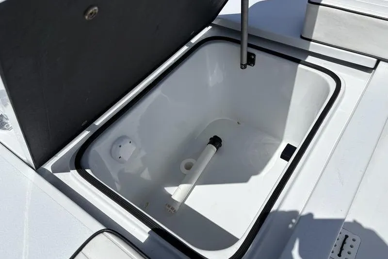 Slide: The Image of Open storage compartment on 2022 East Cape Vantage boat. - 21