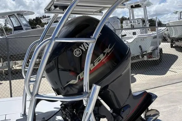 Slide: The Image of 2022 East Cape Vantage boat with Yamaha VMAX outboard motor in a marina setting. - 24