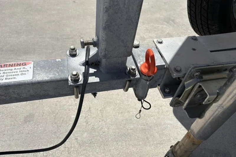 Slide: The Image of Trailer hitch mechanism on a 2022 East Cape Vantage boat trailer. - 3