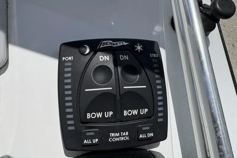 Slide: The Image of Trim tab control panel on a 2022 East Cape Vantage boat. - 6