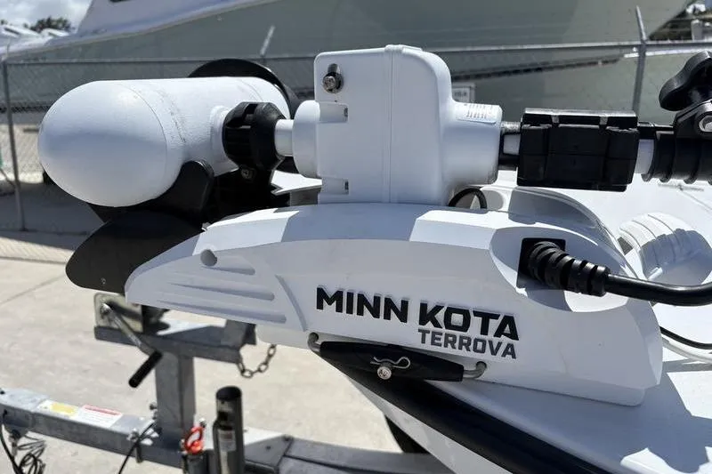 Slide: The Image of Minn Kota Terrova motor on 2022 East Cape Vantage boat, docked outdoors. - 8