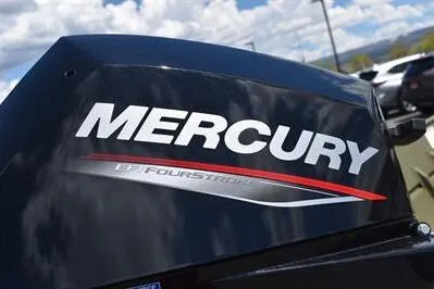 Slide: The Image of Mercury FourStroke engine on a 2024 Lowe L1448 Jon boat under a cloudy sky. - 6