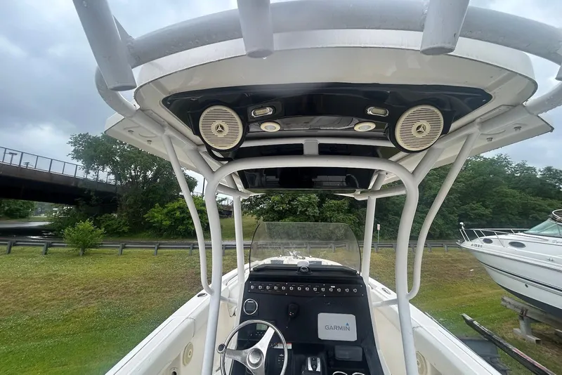 Slide: The Image of 2016 Wellcraft 242 Fisherman boat interior with Garmin navigation system and speakers. - 3