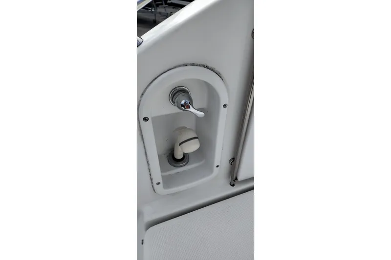 Slide: The Image of Control panel on a 2005 Formula 330 Sun Sport boat, featuring a lever and knob. - 11