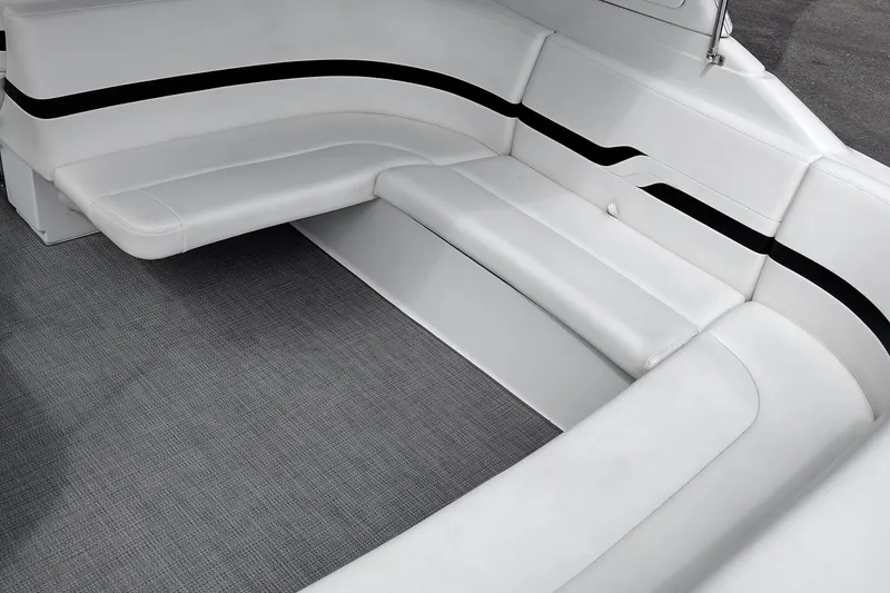Slide: The Image of 2005 Formula 330 Sun Sport boat interior with white seating and black accents. - 13