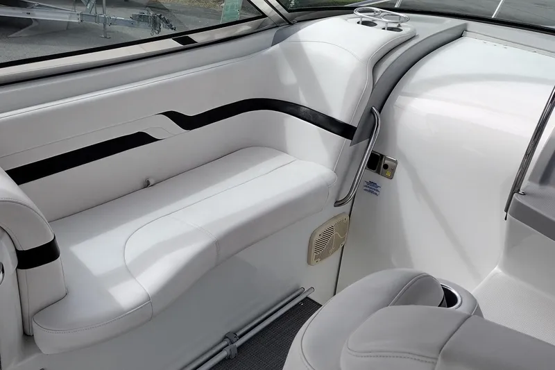 Slide: The Image of Interior seating of a 2005 Formula 330 Sun Sport boat, featuring white upholstery. - 15