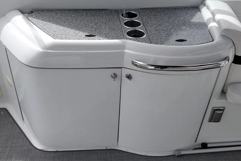 Slide: The Image of 2005 Formula 330 Sun Sport boat interior with sleek countertop and cup holders. - 16
