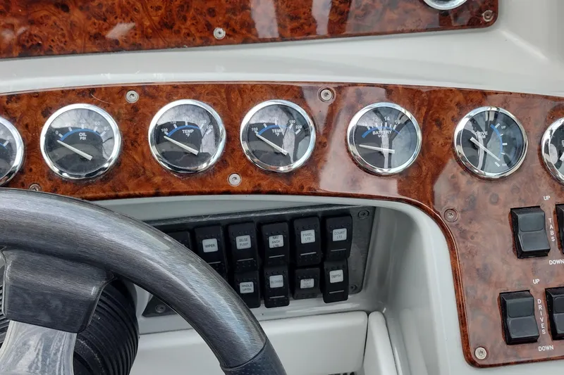 Slide: The Image of Dashboard of a 2005 Formula 330 Sun Sport boat with gauges and controls. - 23