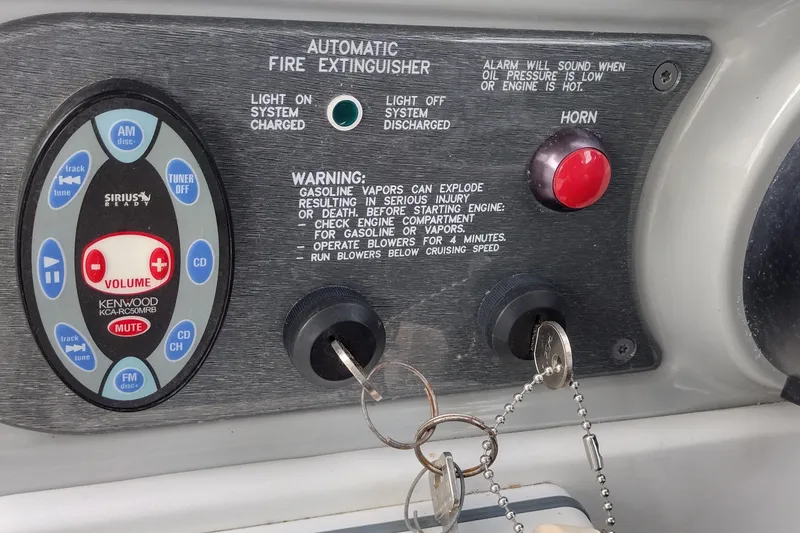 Slide: The Image of Control panel of a 2005 Formula 330 Sun Sport boat with fire extinguisher system and Kenwood audio. - 24