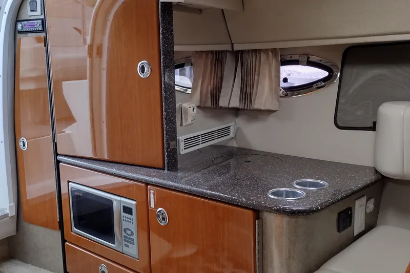 Slide: The Image of Interior of a 2005 Formula 330 Sun Sport boat with kitchenette and microwave. - 32