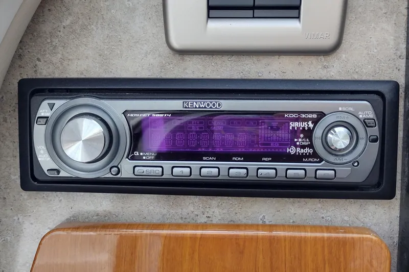 Slide: The Image of Kenwood KDC-3028 stereo in 2005 Formula 330 Sun Sport boat dashboard. - 38