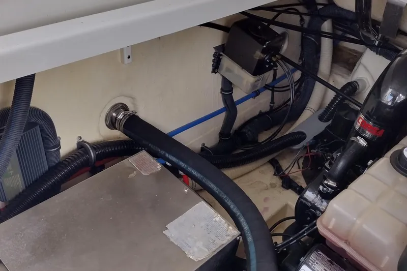 Slide: The Image of Engine compartment of a 2005 Formula 330 Sun Sport boat, showing hoses and components. - 46