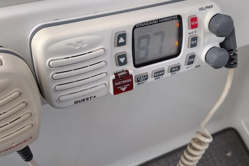Slide: The Image of Standard Horizon marine radio on a 2005 Formula 330 Sun Sport boat dashboard. - 47