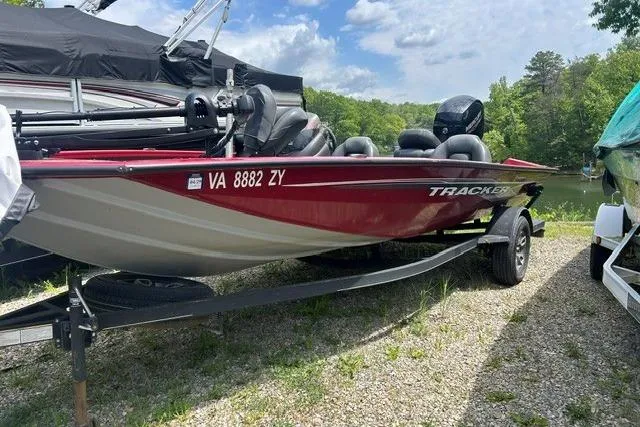 The Image of 2023 Tracker Pro Team 195 TXW Tournament Edition boat on trailer, parked outdoors. - 0