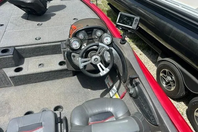 Slide: The Image of 2023 Tracker Pro Team 195 TXW Tournament Edition boat cockpit with steering wheel and controls. - 7