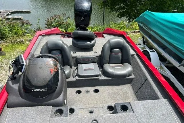 Slide: The Image of 2023 Tracker Pro Team 195 TXW Tournament Edition boat interior with seating and controls. - 8