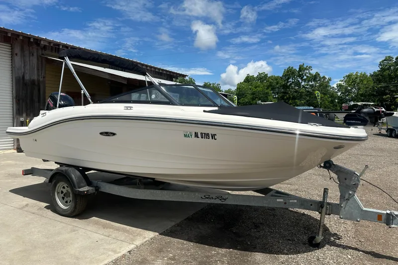 The Image of 2017 Sea Ray SPX 190 Outboard boat on trailer, parked outdoors under blue sky. - 0