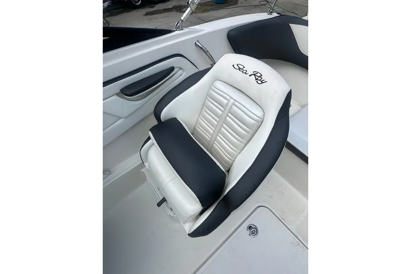Slide: The Image of 2017 Sea Ray SPX 190 Outboard boat seat, featuring black and white upholstery. - 16