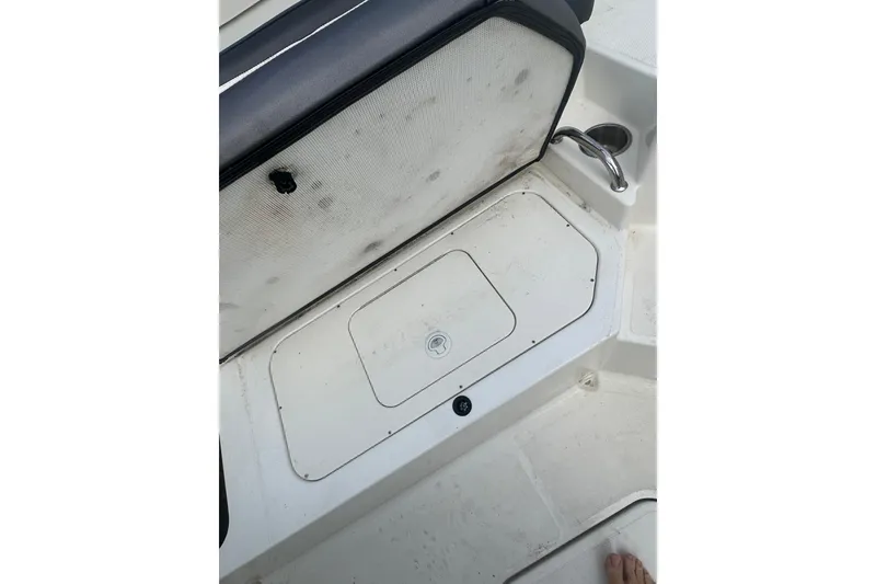 Slide: The Image of 2017 Sea Ray SPX 190 Outboard boat interior with storage compartment and seating. - 20