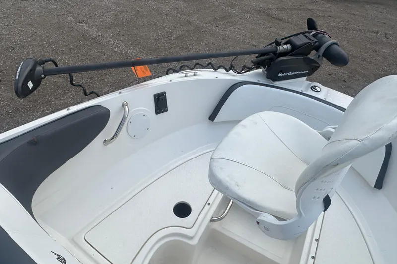 Slide: The Image of 2017 Sea Ray SPX 190 Outboard boat interior with white seating and trolling motor. - 25