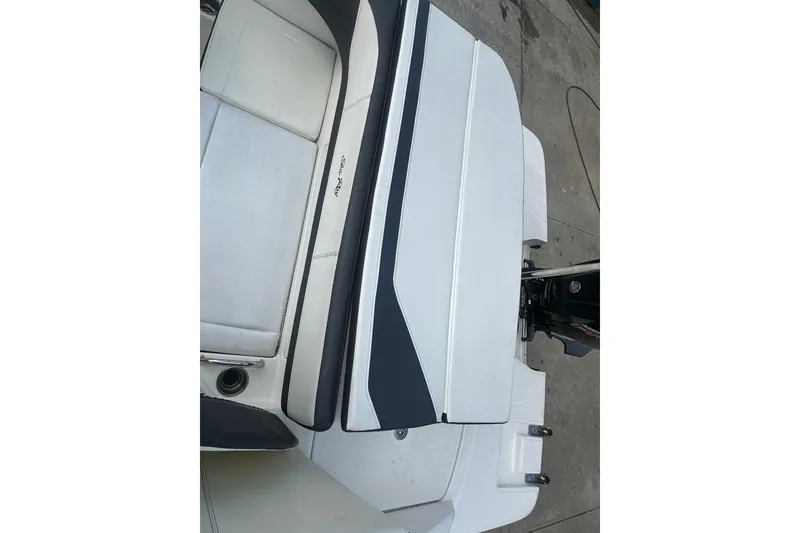 Slide: The Image of 2017 Sea Ray SPX 190 Outboard boat interior with seating and motor detail. - 27