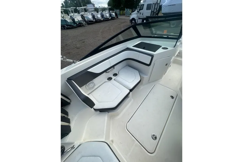 Slide: The Image of 2017 Sea Ray SPX 190 Outboard boat interior with seating and storage compartments. - 28