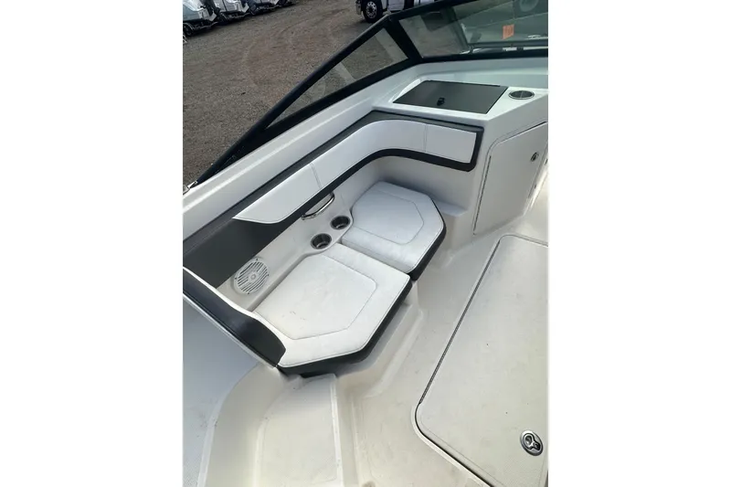 Slide: The Image of 2017 Sea Ray SPX 190 Outboard interior seating with cup holders and storage. - 29