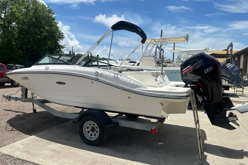 Slide: The Image of 2017 Sea Ray SPX 190 Outboard boat on trailer, featuring a Mercury 115 Pro XS engine. - 3