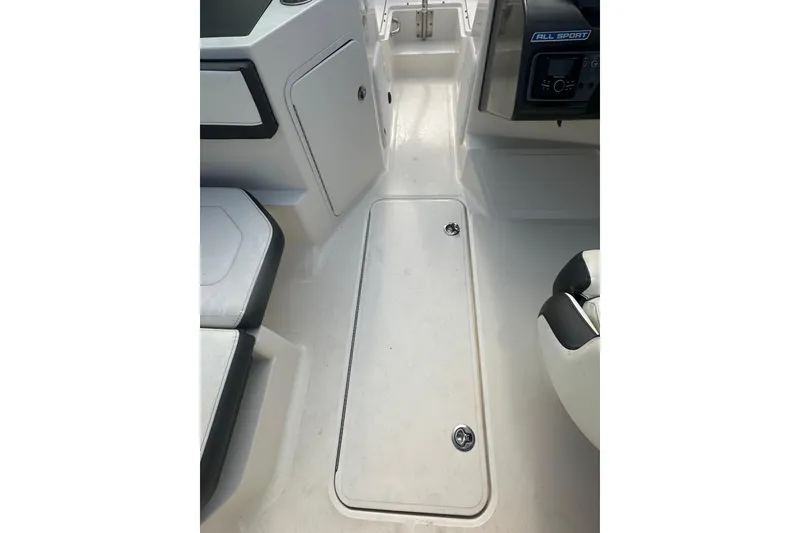 Slide: The Image of 2017 Sea Ray SPX 190 Outboard boat interior, featuring sleek seating and storage compartments. - 30