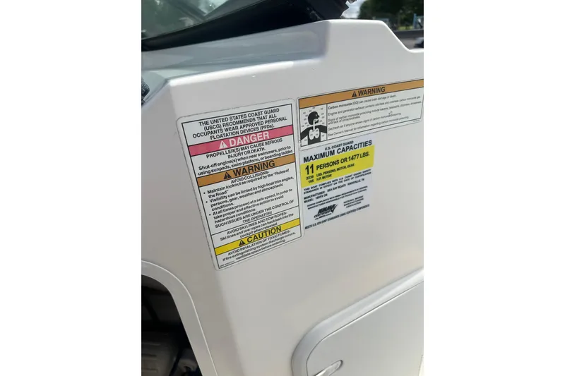 Slide: The Image of 2017 Sea Ray SPX 190 Outboard safety and capacity warning labels. - 32