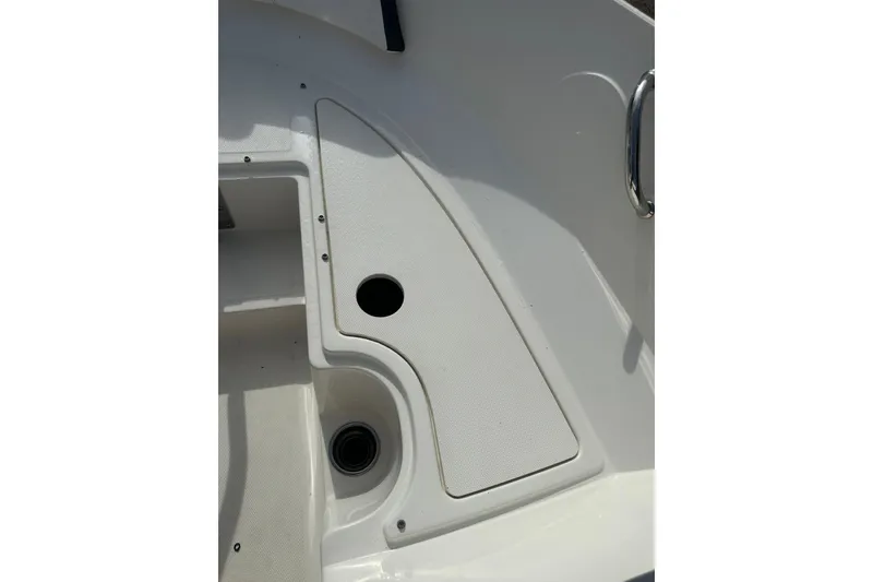 Slide: The Image of 2017 Sea Ray SPX 190 Outboard boat deck with storage compartment and handle. - 34