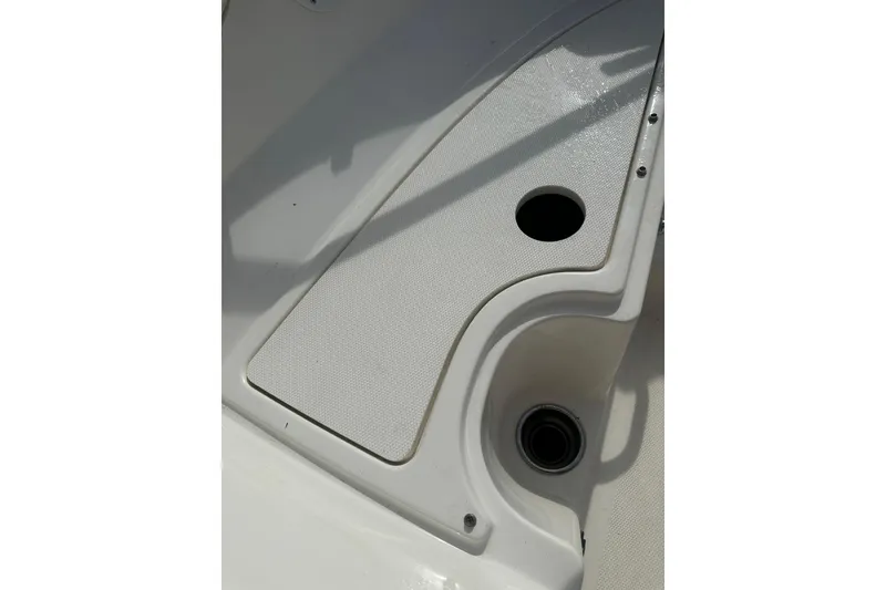 Slide: The Image of 2017 Sea Ray SPX 190 Outboard boat deck with cup holders and textured surface. - 36