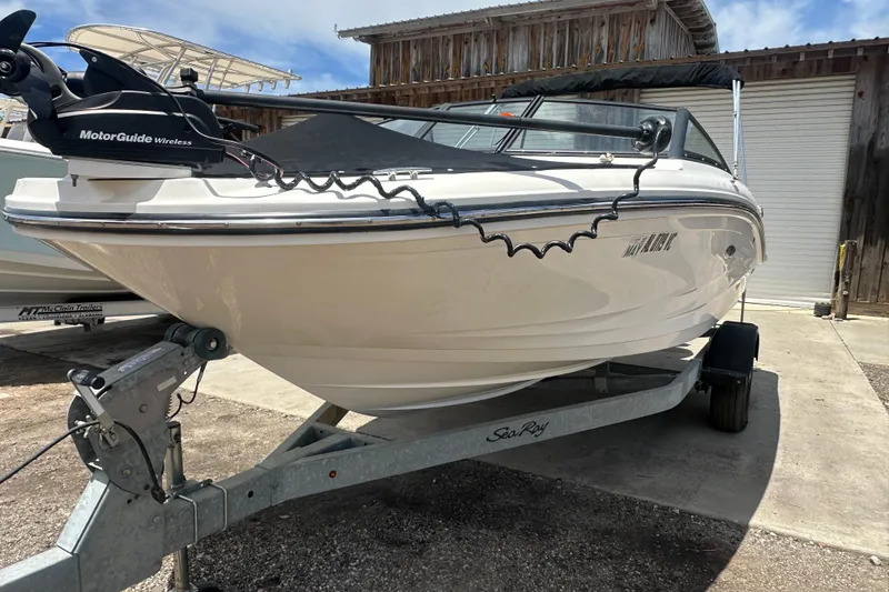Slide: The Image of 2017 Sea Ray SPX 190 Outboard boat on trailer, featuring MotorGuide wireless system. - 6