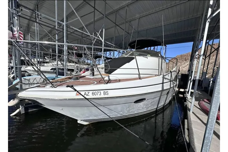 Slide: The Image of 2001 Carver 350 Mariner docked in a covered marina, side view. - 1