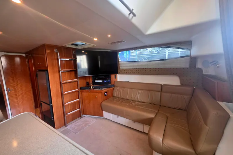 Slide: The Image of Interior of 2001 Carver 350 Mariner yacht with leather seating and modern amenities. - 17