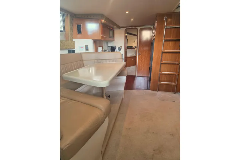 Slide: The Image of Interior of 2001 Carver 350 Mariner yacht with dining area and ladder. - 25